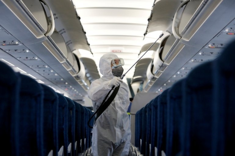 A health worker sprays disinfectant inside a vietnam airlines airplane to protect from the recent coronavirus outbreak, at noi bai airport in hanoi, february 21, 2020. (photo: reuters) 